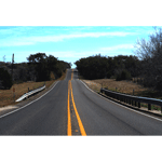 stock photo blue sky and open road with yellow lines